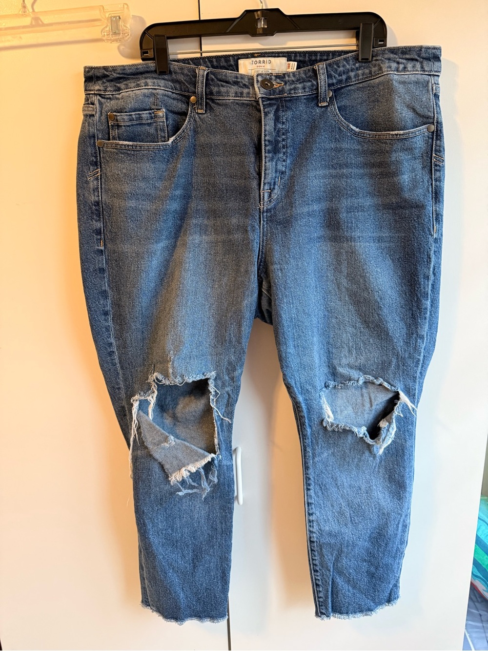 torrid distressed blue boyfriend jeans with knee rips